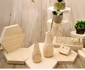 Wooden jewelry display stand detail showing hexagon wooden bases and small vases for shooting.