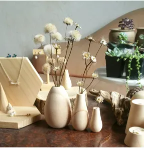 Wooden vase set and jewelry display stand for home decor and retail window props.