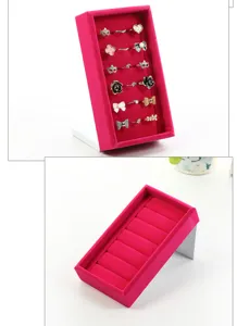 Pink velvet ring display stand holder tray for retail store counter jewelry showcase.