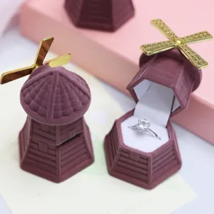 Windmill velvet ring box detail showing open storage box with diamond ring inside gift.