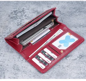 Interior detail of red soft leather long wallet with multi card slots and phone pocket