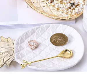 Nordic ceramic pineapple jewelry tray with golden leaf spoon and ring detail display plate.