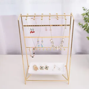 Présentoir à bijoux en métal galvanisé minimaliste avec plateau pour boucles d'oreilles colliers.