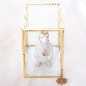 Geometric glass jewelry box with gold trim, clear storage organizer for rings, earrings and accessories.