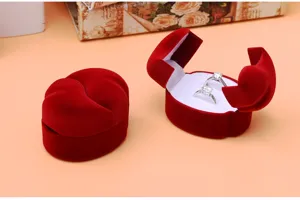 Red velvet heart shaped ring box for couple wedding engagement jewelry storage display detail.