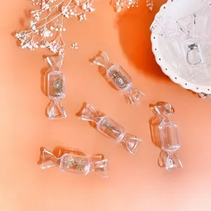 Detailed view of transparent candy shaped jewelry boxes displaying portable mini accessories design.