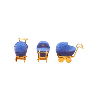 Blue velvet baby stroller jewelry box with gold accents, cute ring storage container.
