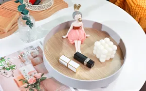Japanese style round storage tray with cute resin girl figurine, perfect desktop organizer for home.