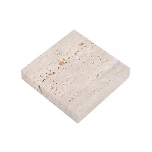 Close-up detail of natural travertine stone photography prop tray for jewelry display.