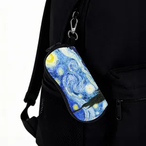 Close-up detail of Van Gogh Starry Night print eyeglasses case hanging on a bag