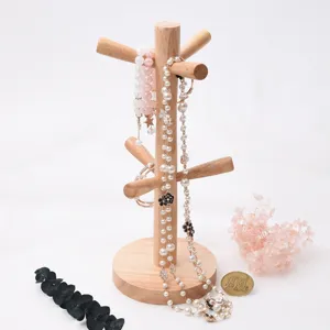Solid wood jewelry display stand, wooden necklace storage rack and mug tree organizer for home decor.