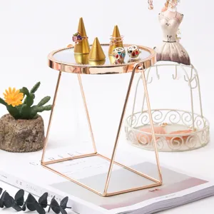 Desktop makeup mirror vanity mirror with ring holders and tray for jewelry display.