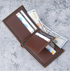 Detail showing internal card slots and compartments of the brown PU leather wallet