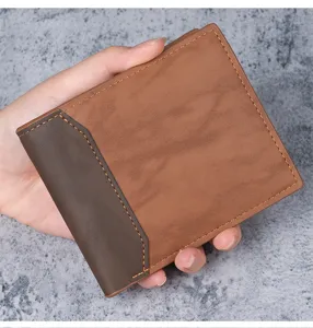 Detail view of men's short PU leather wallet with two-tone brown texture and stitching