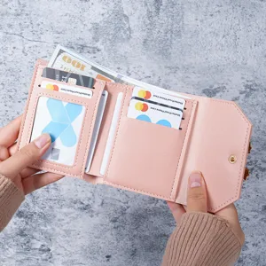 Elegant pink women's short wallet featuring multiple card slots and a clear ID window
