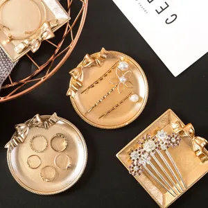 Vintage resin bow jewelry tray, antique gold decorative storage plate for earrings and rings.