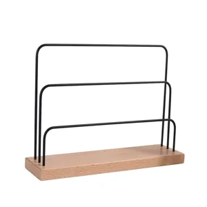Minimalist multi-tier metal and wood earring display stand for home jewelry organization.