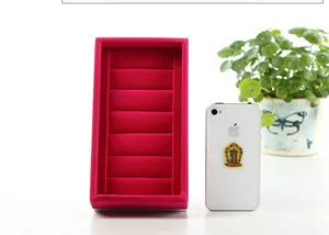 Red velvet ring display tray detail view, soft velvet jewelry showcase organizer for ring.