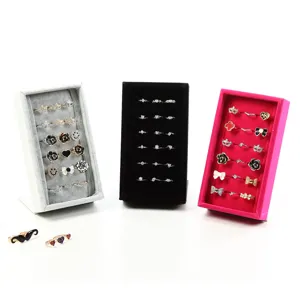 Velvet ring display stand set with grey, black and pink trays for jewelry counter organization.
