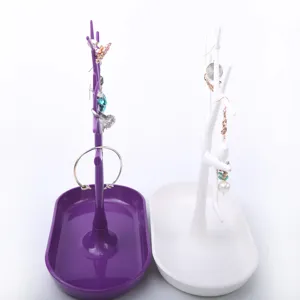 Tree branch jewelry stand with storage tray for rings earrings bracelets necklaces view.