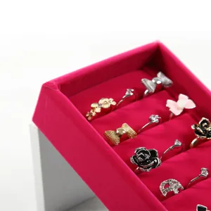 Pink velvet ring display tray holder for jewelry store counter showcase ring organizer prop.