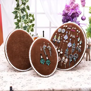 Velvet pearl oval jewelry display stand set for earrings and studs, elegant desktop organizer.