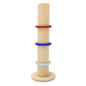 Vertical burlap jewelry display stand bracelet holder tower with three colorful beads.