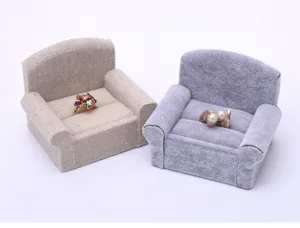 Detailed shot of mini sofa ring holder showing soft fabric texture and ring slots.