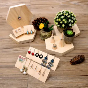 Wooden jewelry display stand set including ring holder, necklace stand, and earring tray.