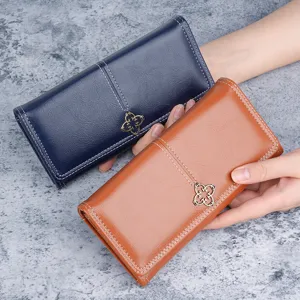 Stylish women's long soft leather wallet with flower clasp, multi-card slot design.