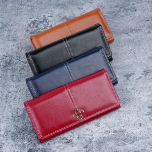 Fashionable women's long soft leather wallets in multiple colors with clover emblem detail