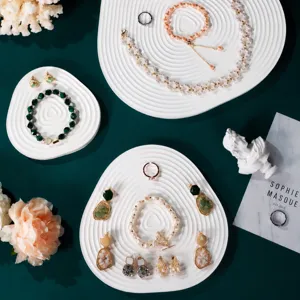 Geometric plaster jewelry display tray white decorative plate for earrings and necklaces photos.