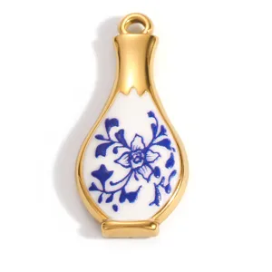 Close-up of vase pendant showing blue and white porcelain pattern with 18K gold plating
