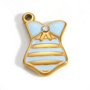 Detailed macro view of gold-plated corset pendant featuring light blue enamel stripes and bow