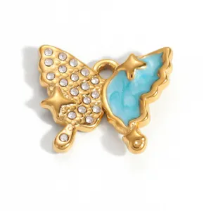 Detail shot of a blue enamel butterfly pendant with 18K gold plating and rhinestones