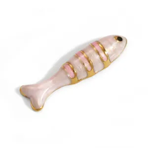 Detail view of 18K gold plated stainless steel fish pendant with pink enamel finish