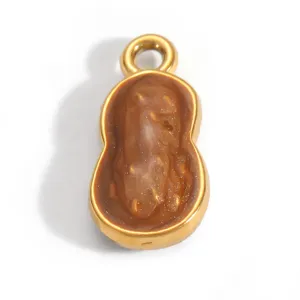 Detailed view of gold-plated stainless steel peanut pendant with brown resin inlay