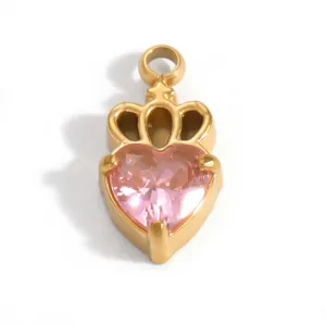 Close-up detail of a 18K gold-plated crown heart pendant with pink crystal
