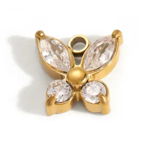 Close-up of a butterfly pendant with clear crystals in gold-plated stainless steel