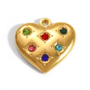 Detailed close-up of gold heart pendant featuring six colorful embedded gemstones