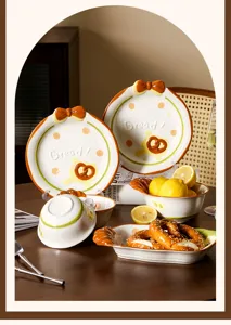 Schönes Keramik Brot Schüssel und Teller Set mit Schleife und Brezel Design für den Küchentisch.
