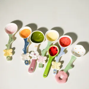 Colorful ceramic dessert spoons with cute flower and butterfly handles for coffee ice cream.