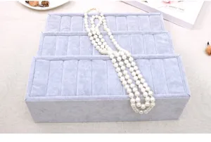 Detailed view of the 3-tier grey velvet ring display tray, perfect for jewelry shops.