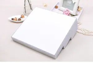 Gray velvet ring display stand detail showing soft texture and slanted tray design.