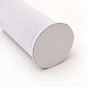 Grey velvet cylinder headband holder display stand for jewelry necklace and earrings.