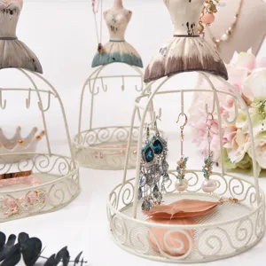 Vintage iron dress form jewelry display stand detail, perfect for earrings, necklaces, rings.