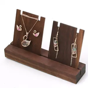 Black walnut wooden jewelry display stand for necklaces and earrings in retail stores.
