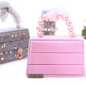Roze fluwelen sieradendoos organizer met parel handvat schattige handtas vorm desktop ringen