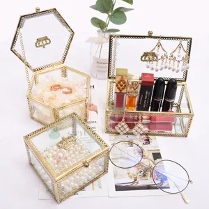 Retro gold glass jewelry box with crown design, elegant desktop makeup and trinket organizer.
