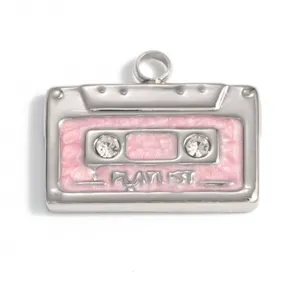 Macro detail of a stainless steel cassette pendant with pink enamel and clear rhinestones